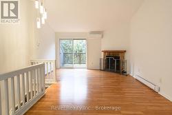 Walkout to a nice deck and treed space. - 