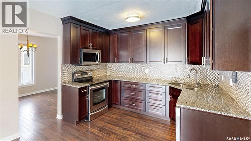 50 Lowry Place, Regina, SK - Indoor Photo Showing Kitchen With Double Sink With Upgraded Kitchen