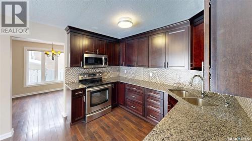 50 Lowry Place, Regina, SK - Indoor Photo Showing Kitchen With Double Sink With Upgraded Kitchen