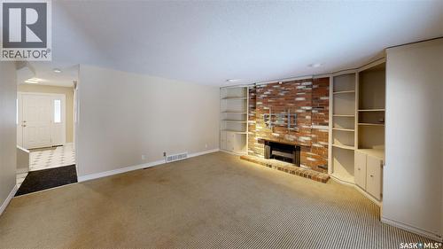 50 Lowry Place, Regina, SK - Indoor Photo Showing Other Room With Fireplace