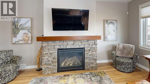 4342 Skinner Place, Regina, SK - Indoor Photo Showing Living Room With Fireplace