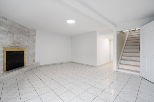 Salle familiale - 4863 Rue Des Cageux, Montréal (Pierrefonds-Roxboro), QC - Indoor Photo Showing Other Room With Fireplace