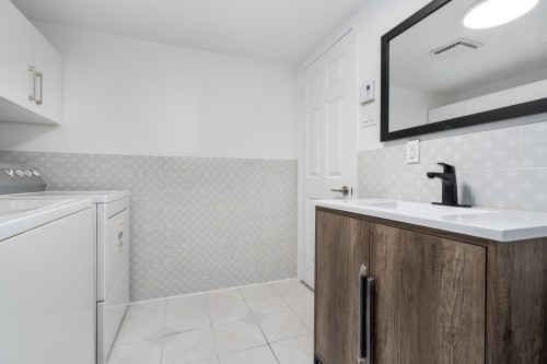 Salle de lavage - 4863 Rue Des Cageux, Montréal (Pierrefonds-Roxboro), QC - Indoor Photo Showing Laundry Room