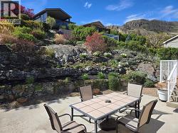 Dine al fresco in the beautiful backyard oasis - 