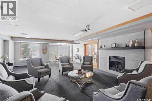 335 325 Keevil Crescent, Saskatoon, SK - Indoor Photo Showing Living Room With Fireplace