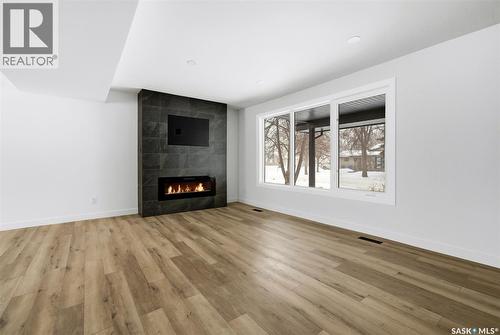 8 Thatcher Road, Regina, SK - Indoor Photo Showing Living Room With Fireplace
