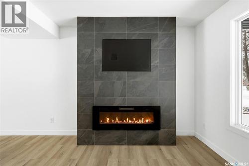 8 Thatcher Road, Regina, SK - Indoor Photo Showing Living Room With Fireplace