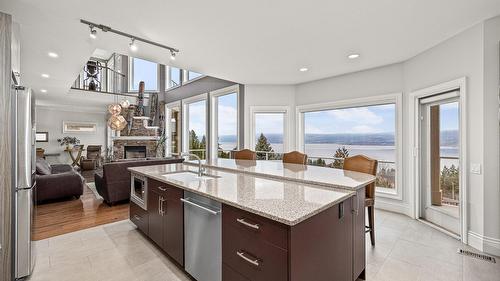 374 Quilchena Drive, Kelowna, BC - Indoor Photo Showing Kitchen With Fireplace