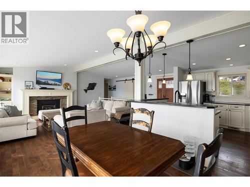 8705 Kalview Drive, Coldstream, BC - Indoor Photo Showing Dining Room With Fireplace