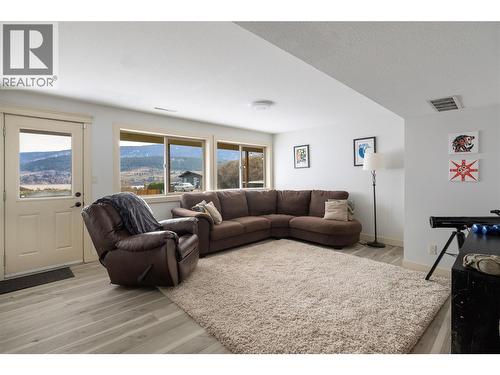 Lower family room - 8705 Kalview Drive, Coldstream, BC - Indoor Photo Showing Living Room