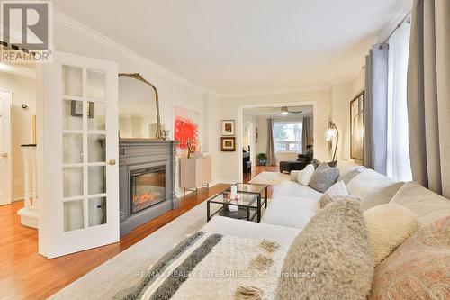 Living Room Open To Office/Den, Hardwood Floors - 431 Naomi Crescent, Mississauga, ON - Indoor Photo Showing Living Room With Fireplace