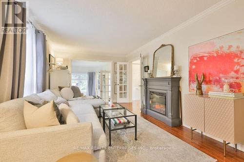 Crown Moulding, Open To Dining/Sitting Room - 431 Naomi Crescent, Mississauga, ON - Indoor Photo Showing Living Room With Fireplace