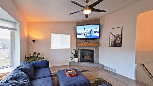208 8Th Street, Cranbrook, BC - Indoor Photo Showing Living Room With Fireplace