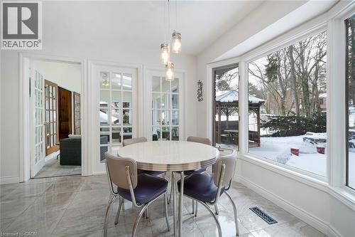 Eat-in kitchen with views of the pool and yard - 18 Stonegate Drive, Hamilton, ON - Indoor Photo Showing Dining Room