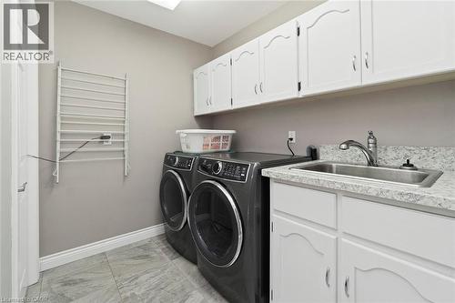 Main level laundry room - 18 Stonegate Drive, Hamilton, ON - Indoor Photo Showing Laundry Room