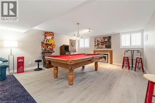 Lower level recreation room with fireplace - 18 Stonegate Drive, Hamilton, ON - Indoor Photo Showing Other Room