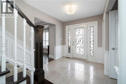 Front door entry with dual closets - 18 Stonegate Drive, Hamilton, ON - Indoor Photo Showing Other Room