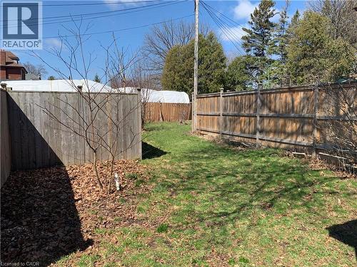 View of fenced backyard - 405 Macnab Street N, Hamilton, ON - Outdoor
