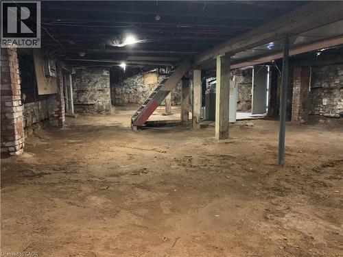 Unfinished basement with water heater - 405 Macnab Street N, Hamilton, ON - 