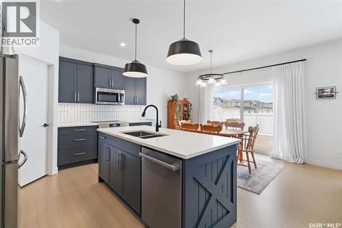 126 Chelsom Bend, Saskatoon, SK - Indoor Photo Showing Kitchen With Double Sink With Upgraded Kitchen