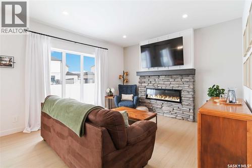 126 Chelsom Bend, Saskatoon, SK - Indoor Photo Showing Living Room With Fireplace