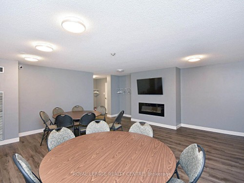 1604-3590 Kaneff Crescent W, Mississauga, ON - Indoor Photo Showing Dining Room With Fireplace