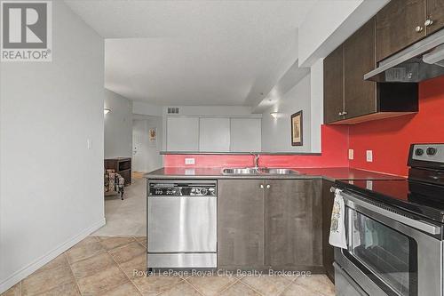 412 - 308 Watson Parkway N, Guelph (Grange Road), ON - Indoor Photo Showing Kitchen With Double Sink