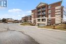 Access to underground parking - 412 - 308 Watson Parkway N, Guelph (Grange Road), ON  - Outdoor With Facade 