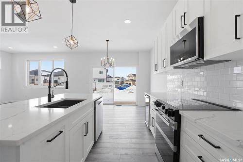 139 Sharma Lane, Saskatoon, SK - Indoor Photo Showing Kitchen With Double Sink With Upgraded Kitchen