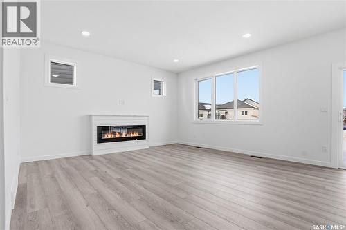 139 Sharma Lane, Saskatoon, SK - Indoor Photo Showing Living Room With Fireplace