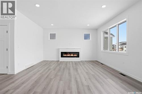 139 Sharma Lane, Saskatoon, SK - Indoor Photo Showing Living Room With Fireplace