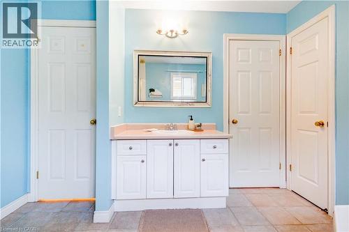 Bathroom with vanity and light tile patterned floors - 65 Thistlemoor Drive, Caledonia, ON - Indoor