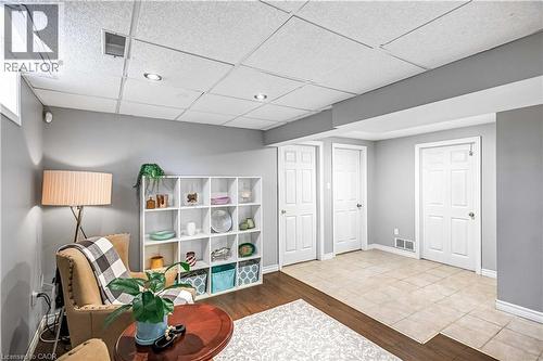 Sitting room with a drop ceiling and wood finished floors - 65 Thistlemoor Drive, Caledonia, ON - Indoor Photo Showing Other Room