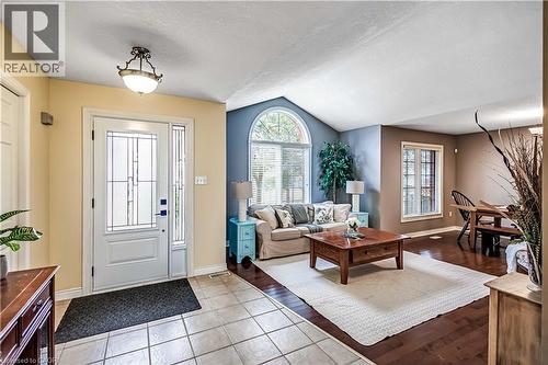 Foyer entrance featuring baseboards and light tile patterned floors - 65 Thistlemoor Drive, Caledonia, ON - Indoor
