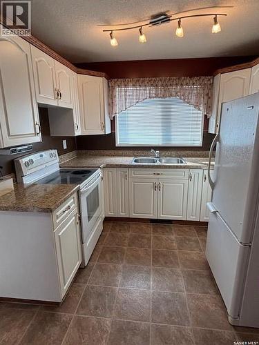 154 Parker Crescent, Canora, SK - Indoor Photo Showing Kitchen With Double Sink
