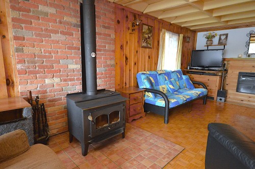 Salon - 12481 Ch. Chadrofer, Labelle, QC - Indoor With Fireplace
