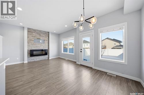 16 1003 Evergreen Boulevard, Saskatoon, SK - Indoor Photo Showing Living Room With Fireplace