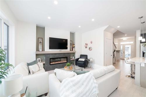 182 Moonlight Bay, Winnipeg, MB - Indoor Photo Showing Living Room With Fireplace