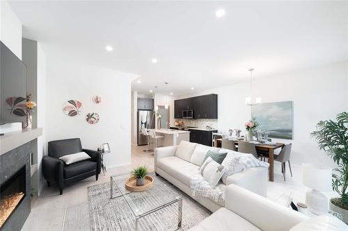 182 Moonlight Bay, Winnipeg, MB - Indoor Photo Showing Living Room With Fireplace