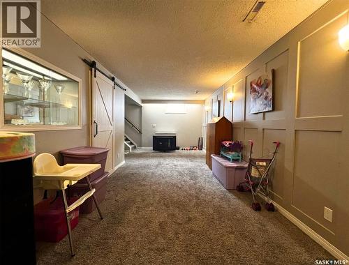 119 Macdonald Place, Swift Current, SK - Indoor Photo Showing Other Room With Fireplace