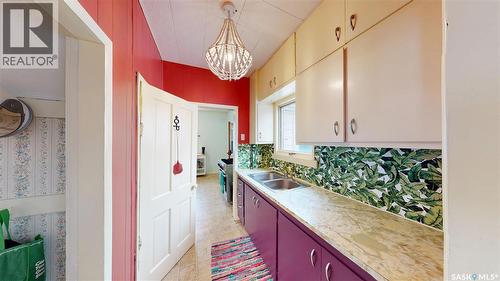 107 3Rd Avenue, Scott, SK - Indoor Photo Showing Kitchen With Double Sink