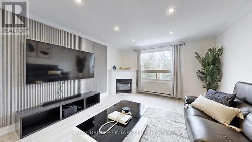26 - 909 King Street W, Oshawa, ON - Indoor Photo Showing Living Room With Fireplace
