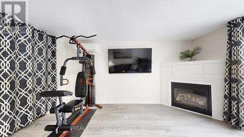26 - 909 King Street W, Oshawa, ON - Indoor With Fireplace