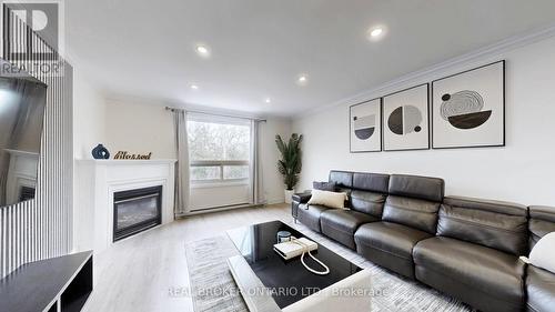 26 - 909 King Street W, Oshawa, ON - Indoor Photo Showing Living Room With Fireplace