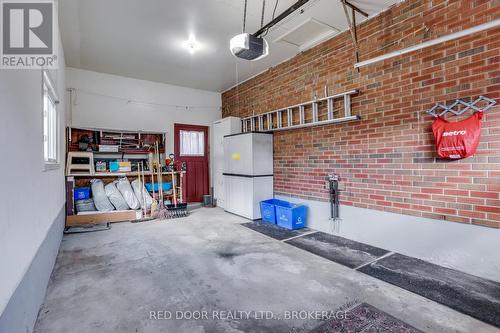 Single car garage with drain and water hookup - 234 Manitoulin Drive, London East (East O), ON - Indoor Photo Showing Garage
