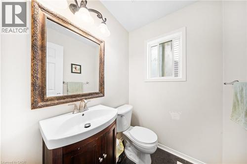 Bathroom featuring vanity and tile patterned flooring - 132 Blackburn Drive, Brantford, ON - Indoor Photo Showing Bathroom