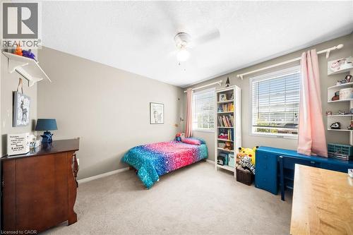 Bedroom featuring light carpet, ceiling fan, and a textured ceiling - 132 Blackburn Drive, Brantford, ON - Indoor Photo Showing Bedroom