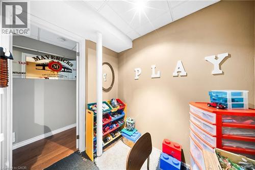 Game room featuring wood finished floors and baseboards - 132 Blackburn Drive, Brantford, ON - Indoor Photo Showing Other Room