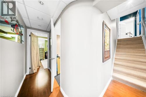 Corridor with light wood-style floors and baseboards - 132 Blackburn Drive, Brantford, ON - Indoor Photo Showing Other Room