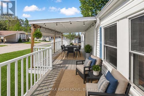 Covered Porch w/8ft Privacy Blind Virtually Staged - 4041 Ash Crescent, Severn, ON 